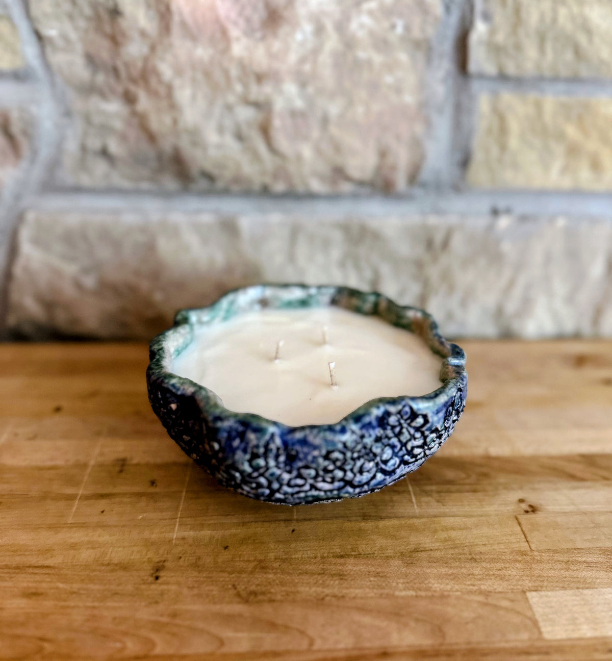 Large blue floral pottery candle