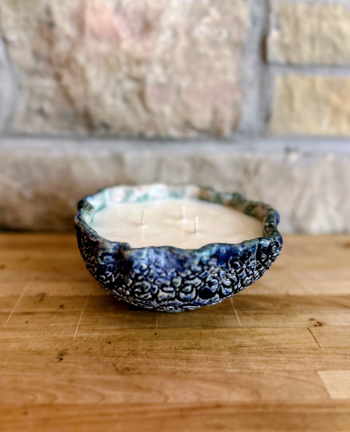 Large blue floral pottery candle