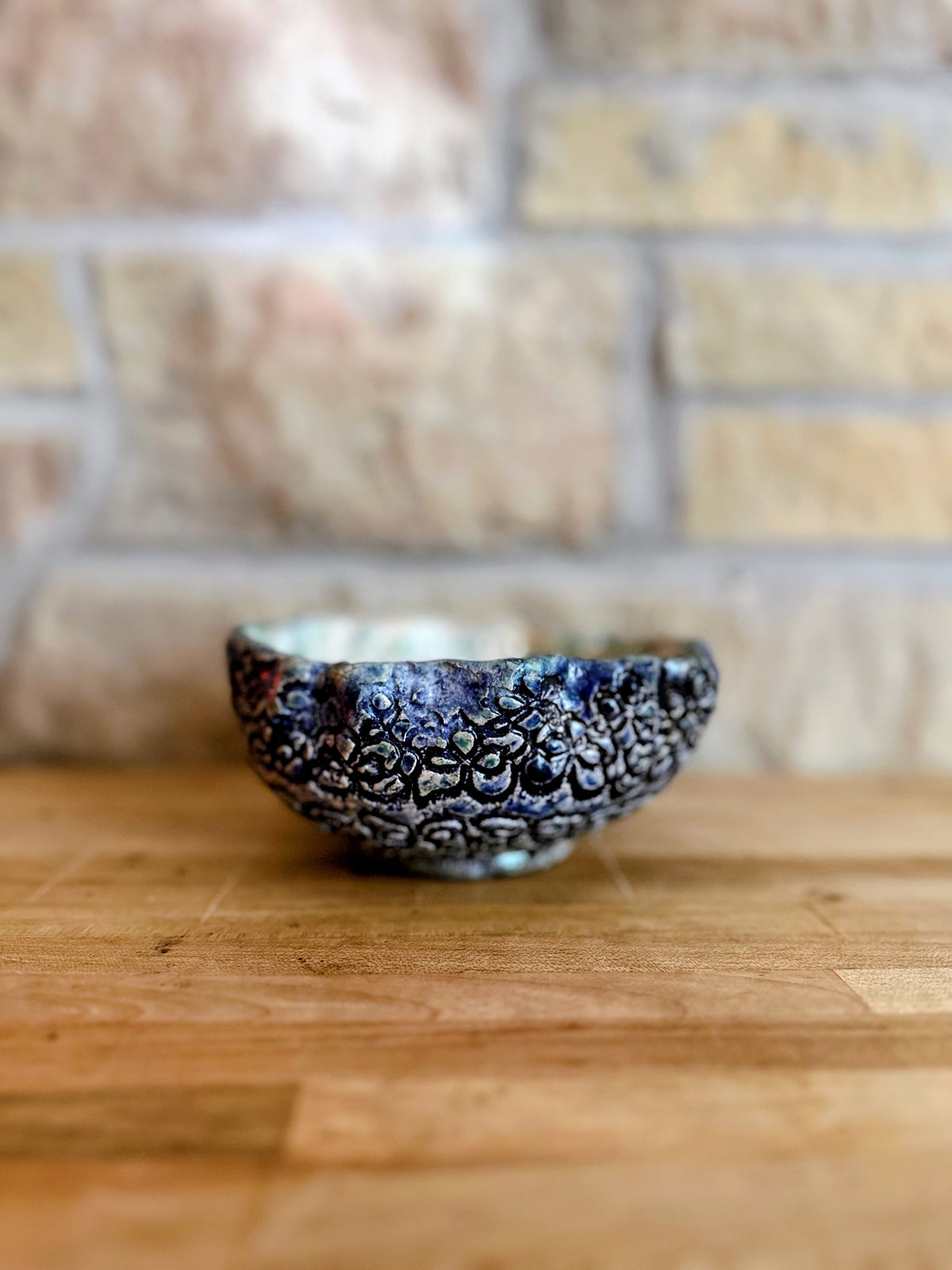 Large blue floral pottery candle